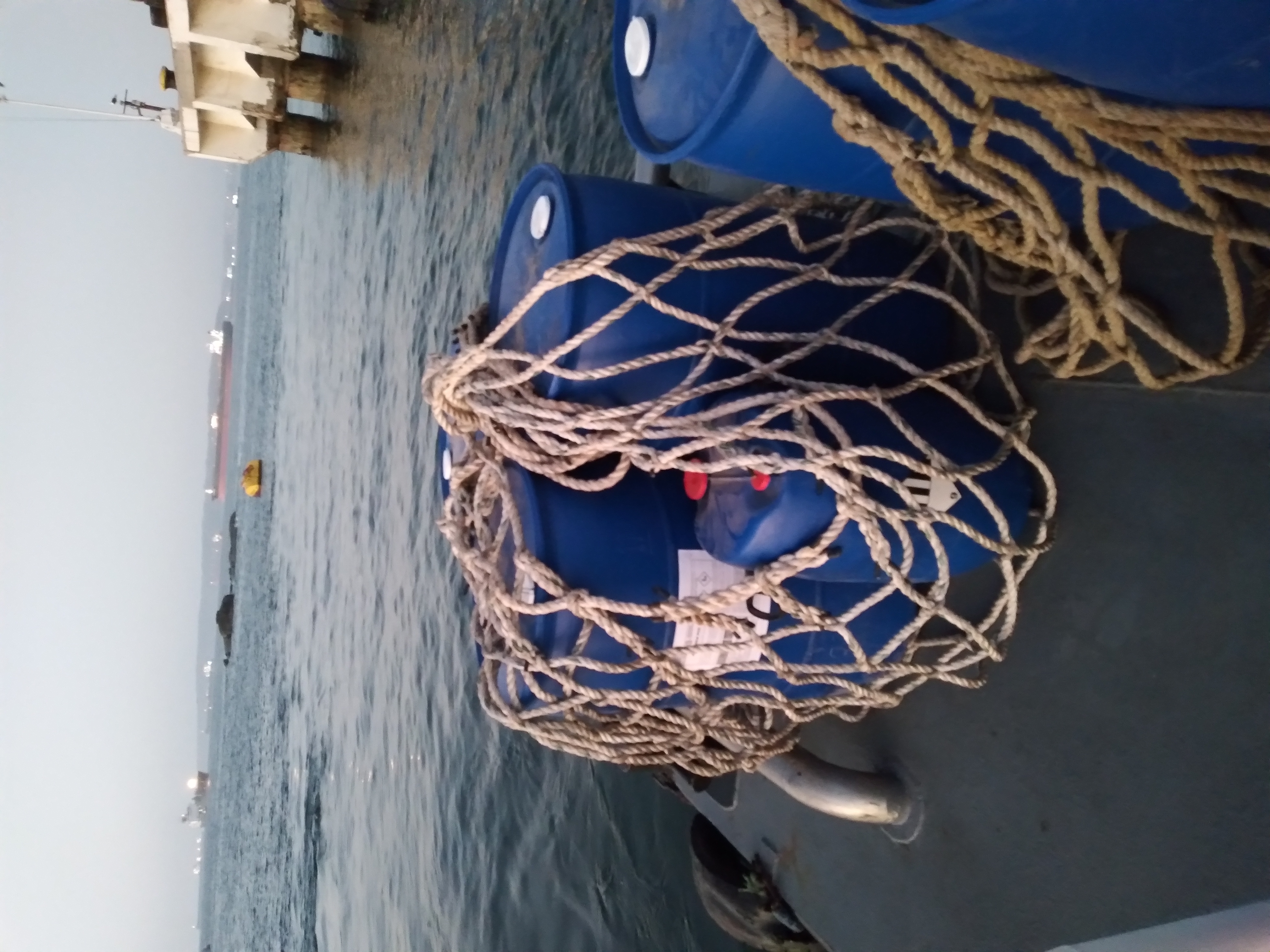 Chemical drums staged at dock for delivery